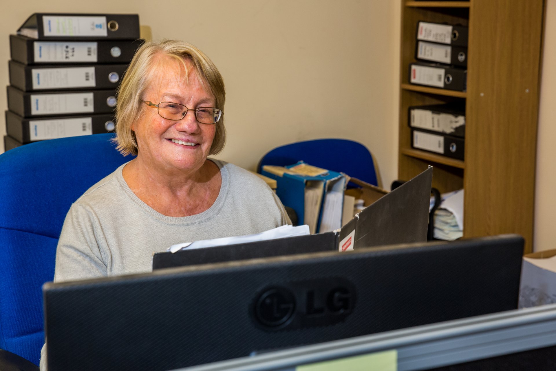 woman working behind computer